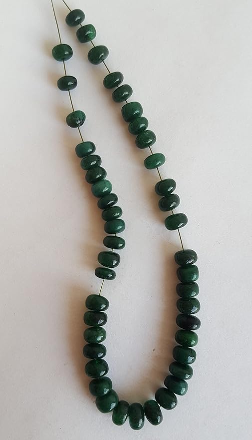 A strand of smooth emerald rondelle gemstone beads, measuring 5mm to 6mm, showcasing their vibrant colour and shine.