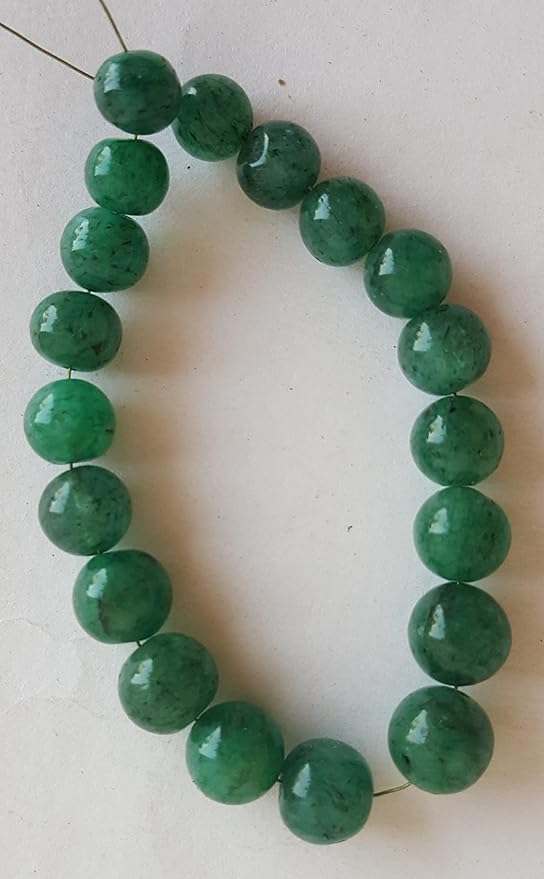 A beautiful strand of green emerald beads, 7mm to 8mm smooth round, radiating elegance and vibrant colour.