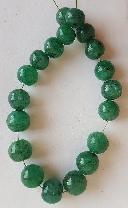 A close-up of a strand of green Emerald beads, 7mm to 8mm in size, highlighting their smooth round design and rich hue.