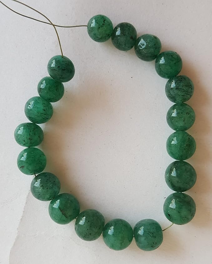 Strand featuring 7mm to 8mm smooth round beads in a vibrant green colour, showcasing the beauty of Emeralds.