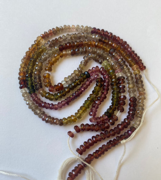 A vibrant strand of 3.5-4mm faceted Tourmaline glass beads, displaying a beautiful array of colours.