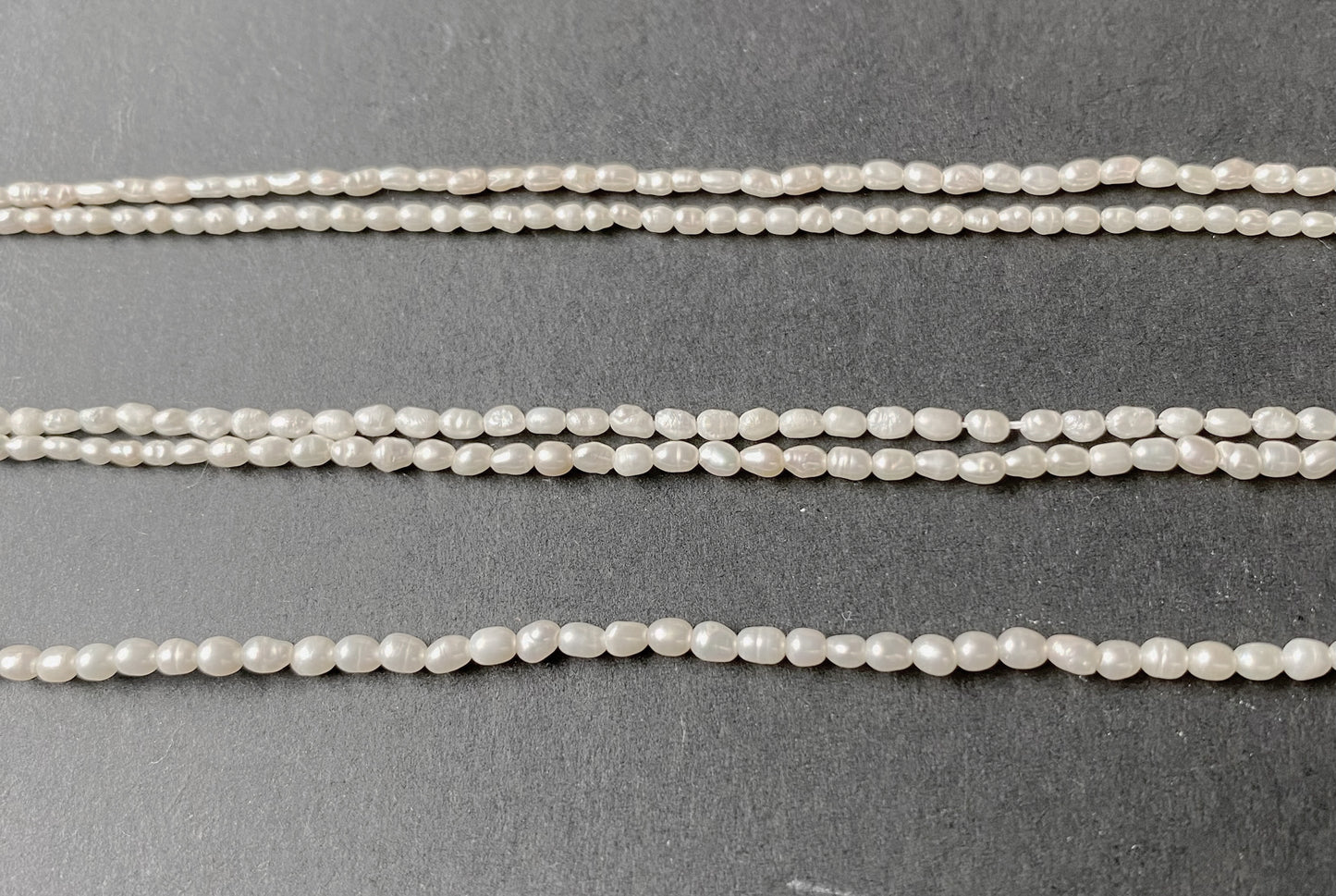 Softly glowing rice-shaped pearls showcasing a refined shimmer and organic beauty.