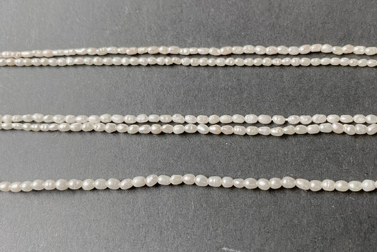 Softly glowing rice-shaped pearls showcasing a refined shimmer and organic beauty.