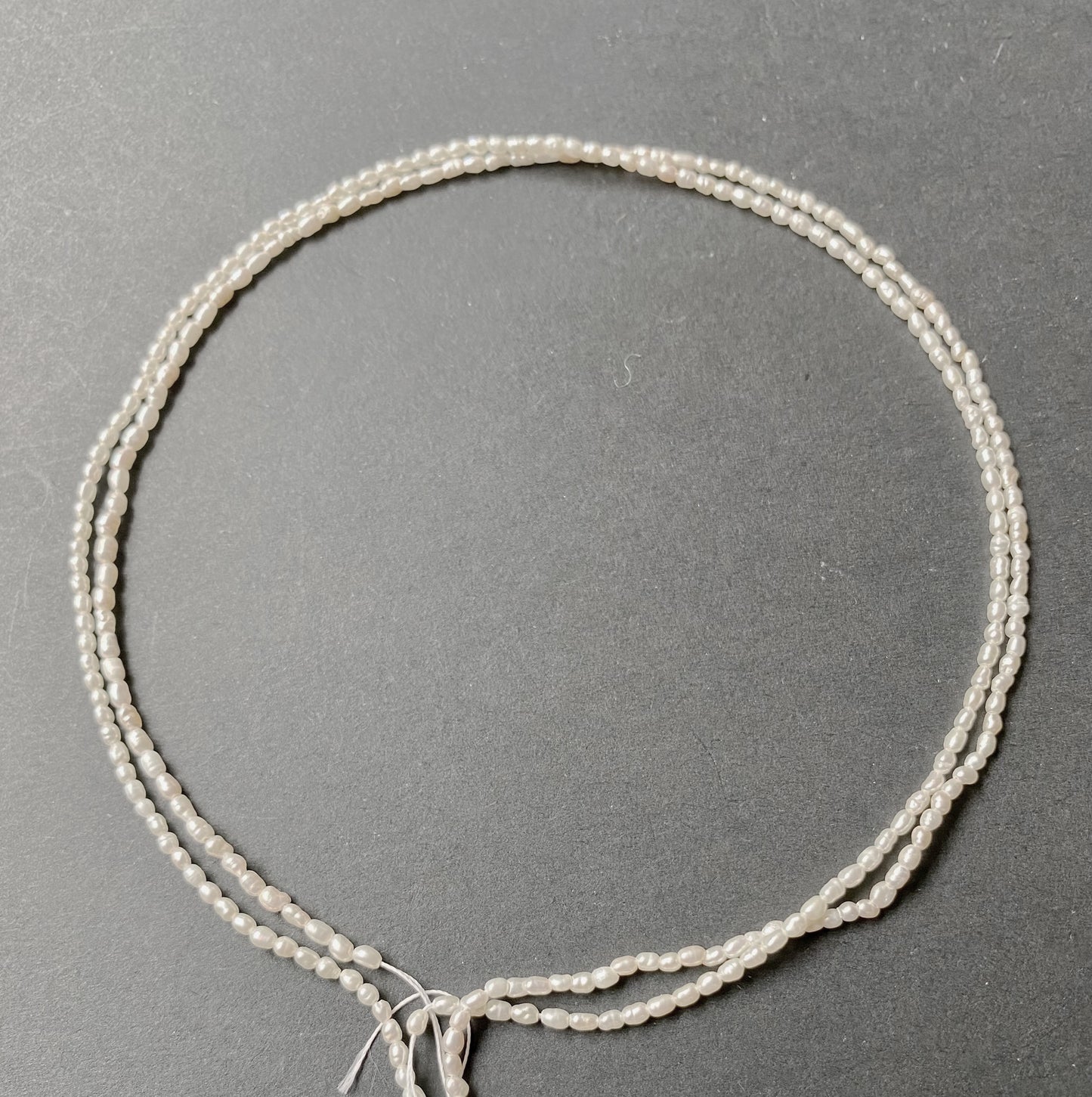 A close-up of Fresh Water Pearls with smooth curves and delicate lustre.