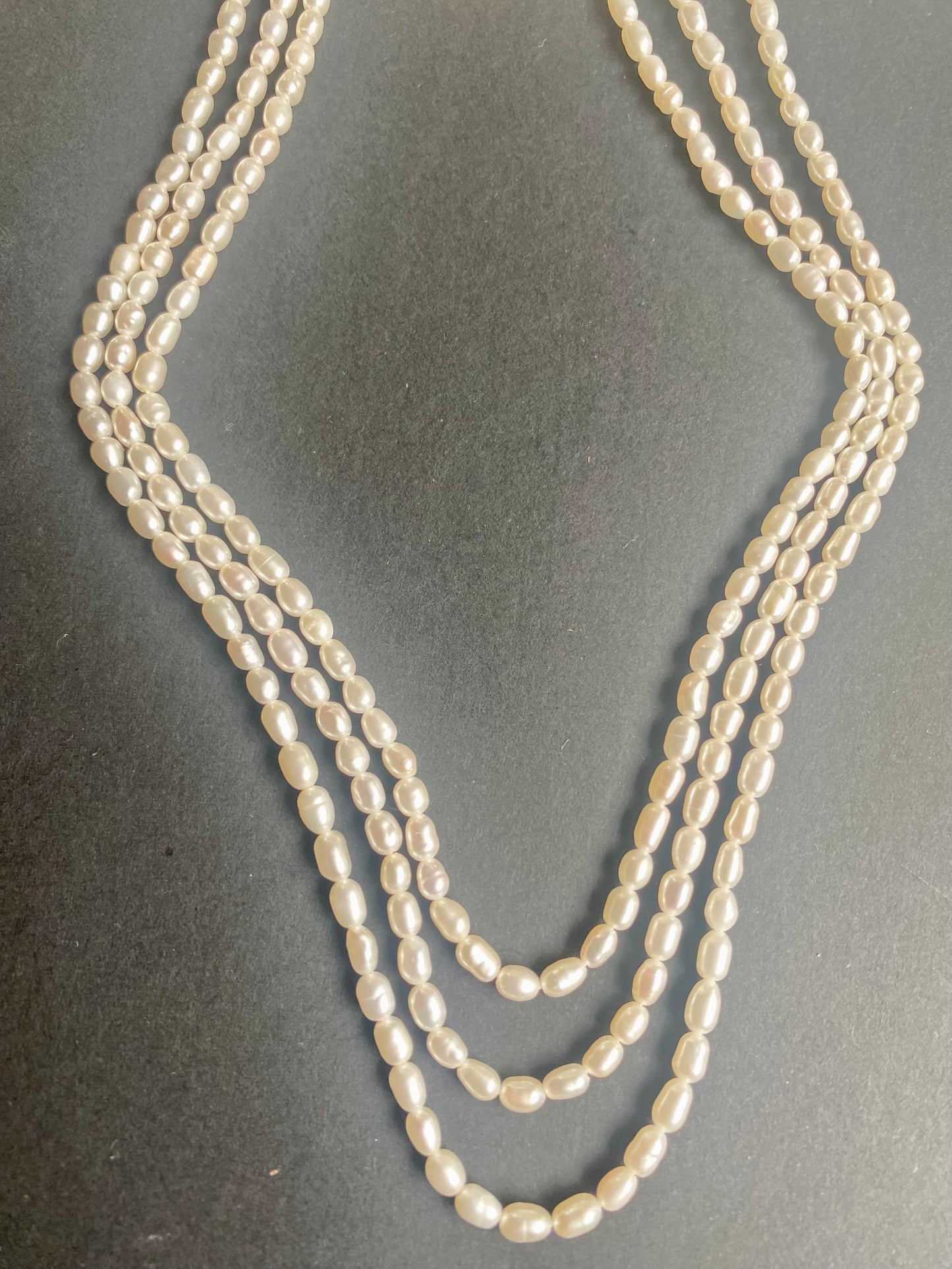 Three strands of freshwater rice pearls, each measuring 3.1-3.5mm in diameter.