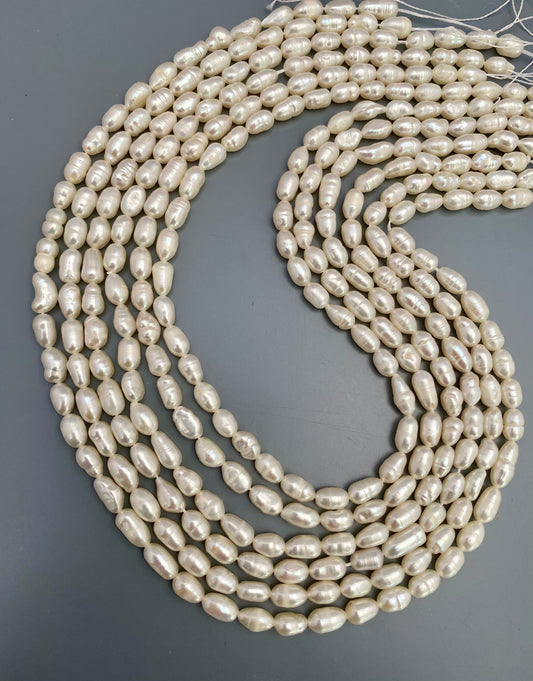 Softly glowing baroque rice pearls showcasing natural irregular shapes and refined shimmer.