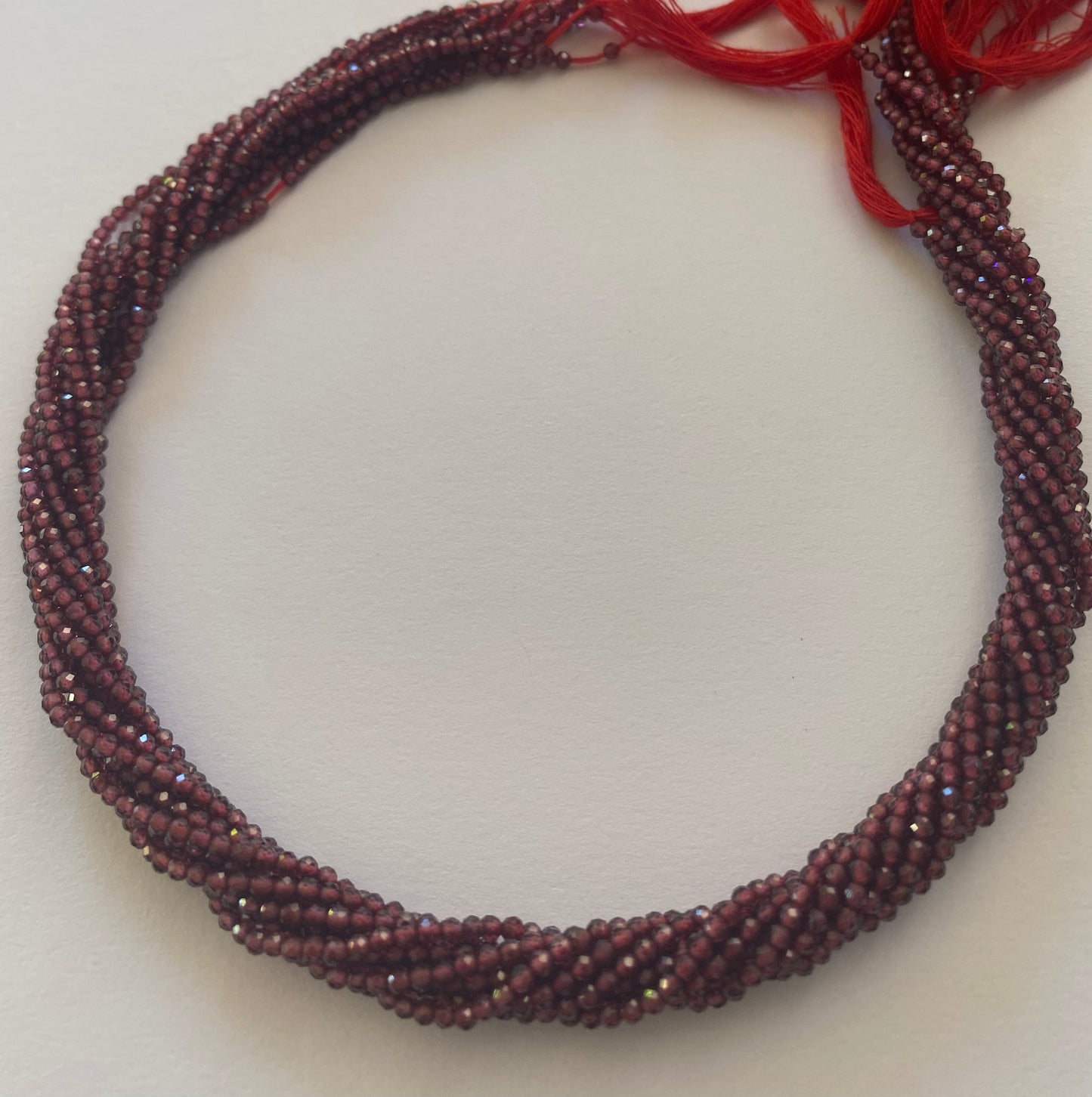 Featuring faceted rondelle Garnet beads, 2.2mm in size, showcasing a beautiful red hue.