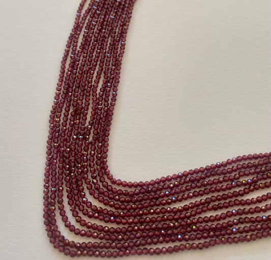 Stunning 2.2mm smooth red Garent gemstone beads, reflecting the unique charm of the stone.