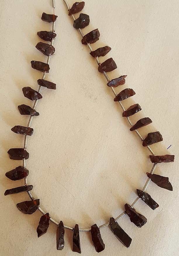Strands featuring Garnet gemstones, beads showcasing a rough, natural texture.