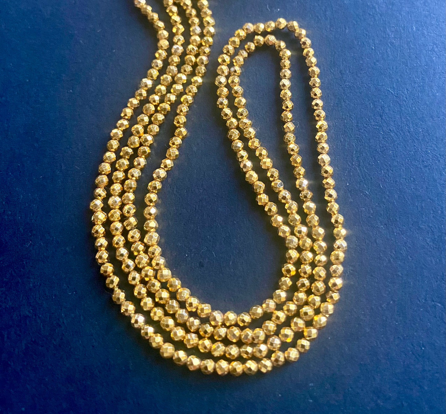Stylish strands made of 3-5mm gold pyrite faceted rondelle beads, highlighting its sophisticated look.