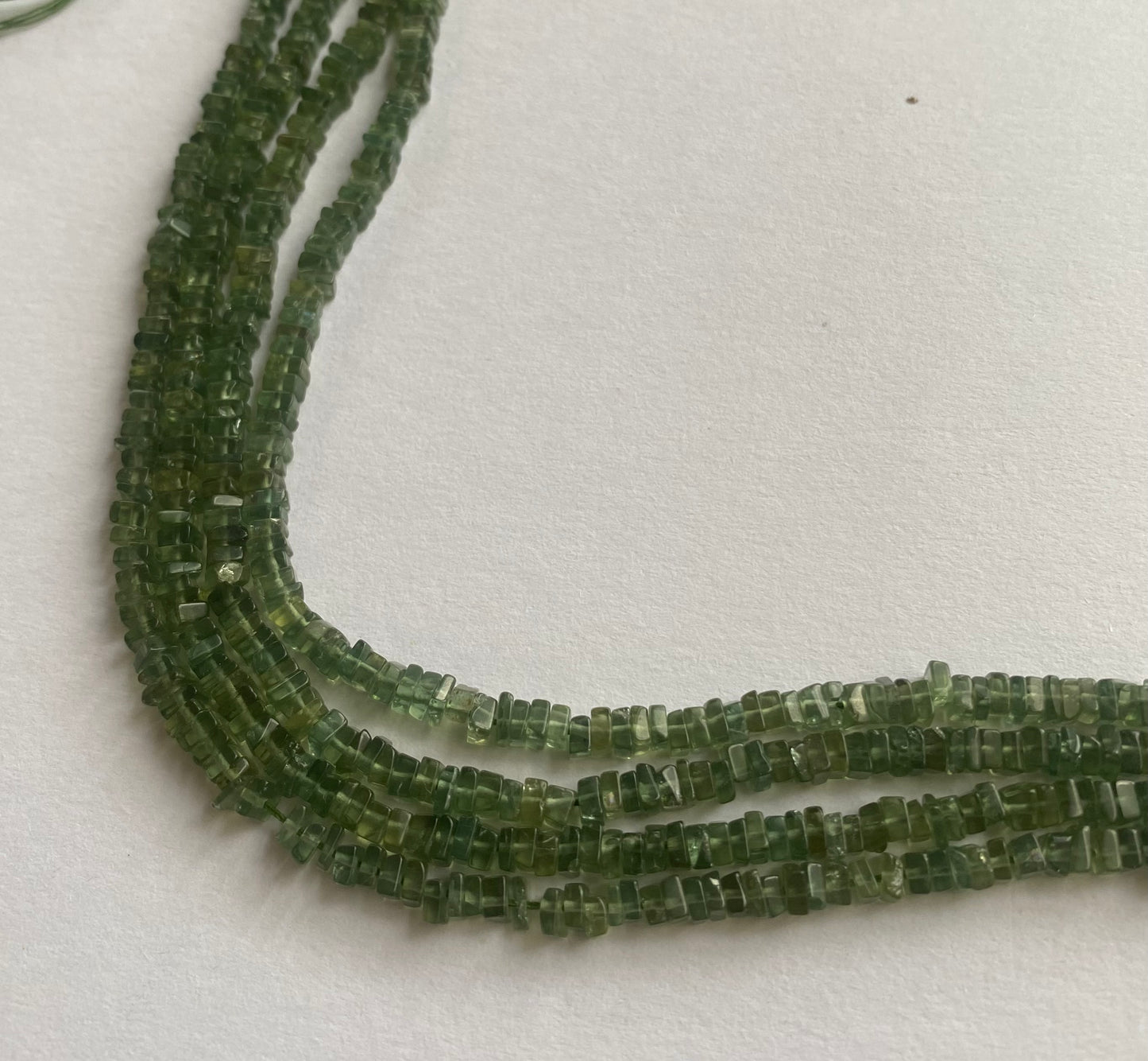 Beautiful green apatite stones,smooth square, measuring between 3.0mm and 3.5mm.