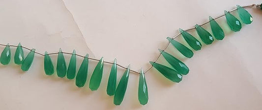 Close-up of a green gemstone bead strand highlighting chalcedony gemstones.
