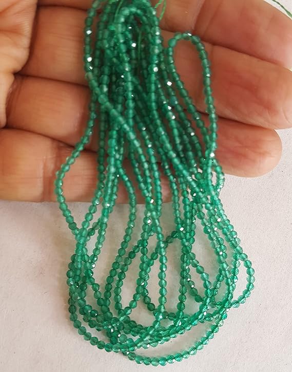 A strand of green onyx beads, featuring 2mmfaceted rondelle shapes, showcasing their vibrant colour and shine.