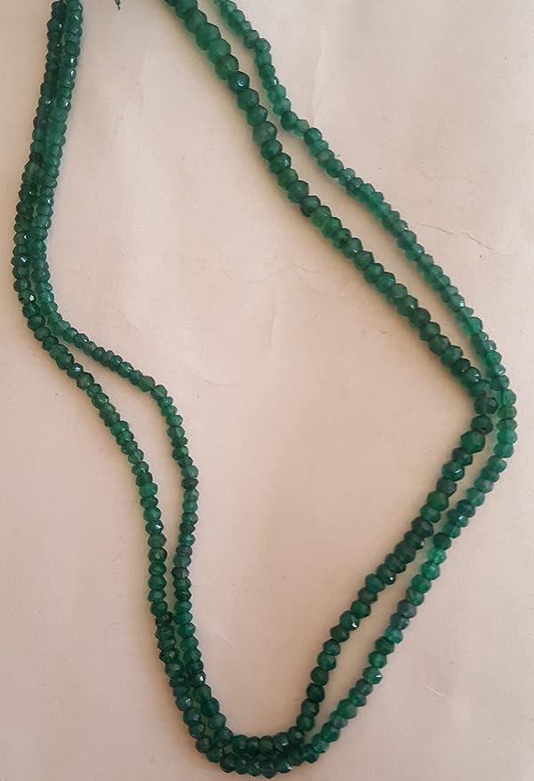 Strand featuring faceted rondelle beads in a vibrant green colour, showcasing the beauty of Green Onyx.