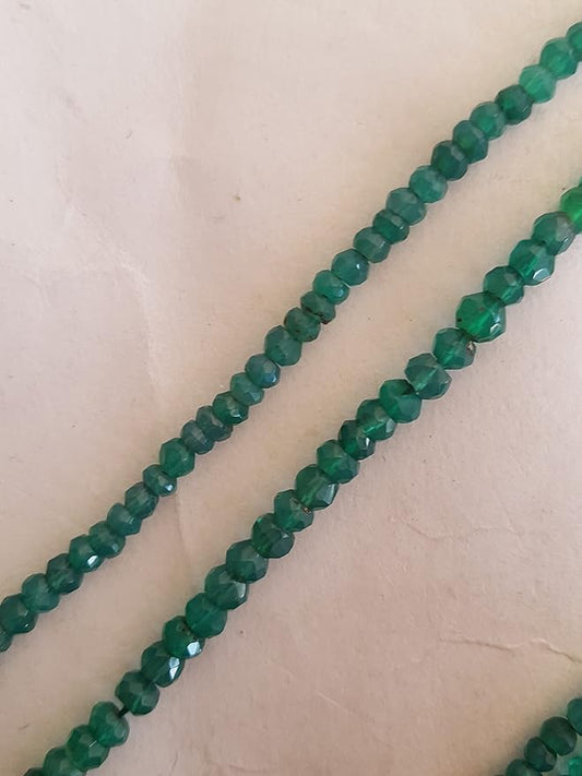 Strands of green onyx beads are displayed closely, highlighting the beads' faceted rondelle design.