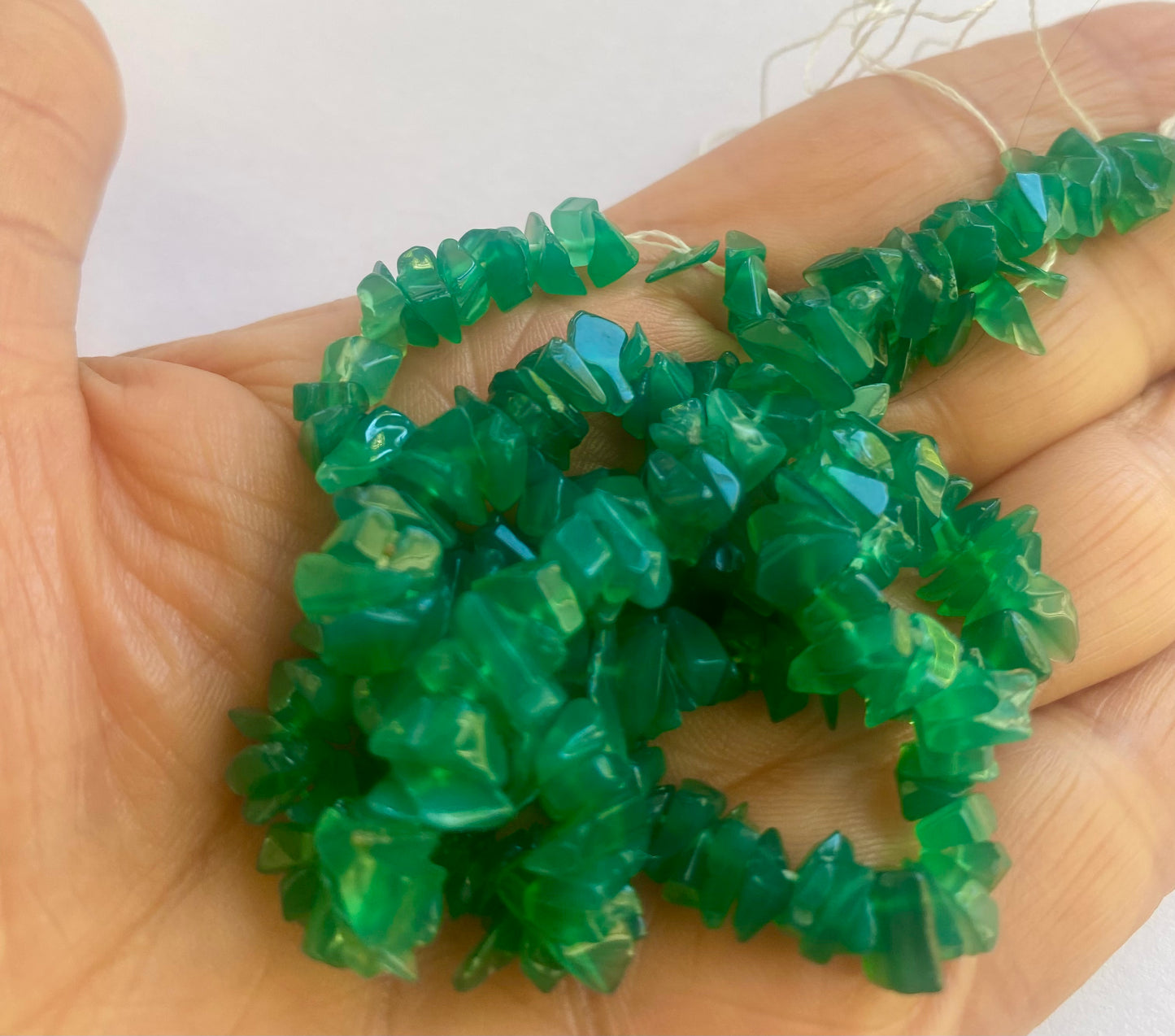 Elegant strand adorned with 5-9mm Green Onyx Uncut Chips beads, perfect for adding a pop of colour.