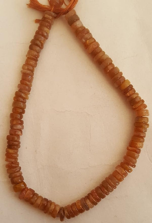 A colourful strand made of smooth wheel-shaped Heishi gemstone beads in brownish hues.