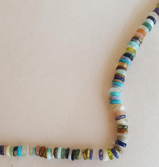 A stunning strand adorned with various coloured Heishi gemstone beads, showcasing smooth wheel designs.