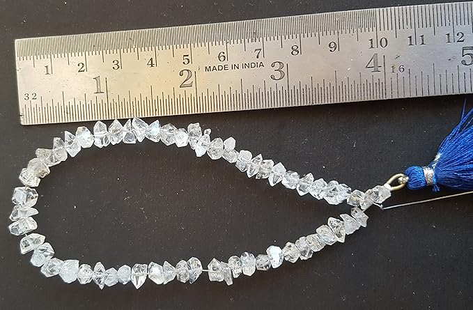 A ruler beside a cluster of Herkimer Diamond gemstone beads, measuring 6mm to 8mm in size.