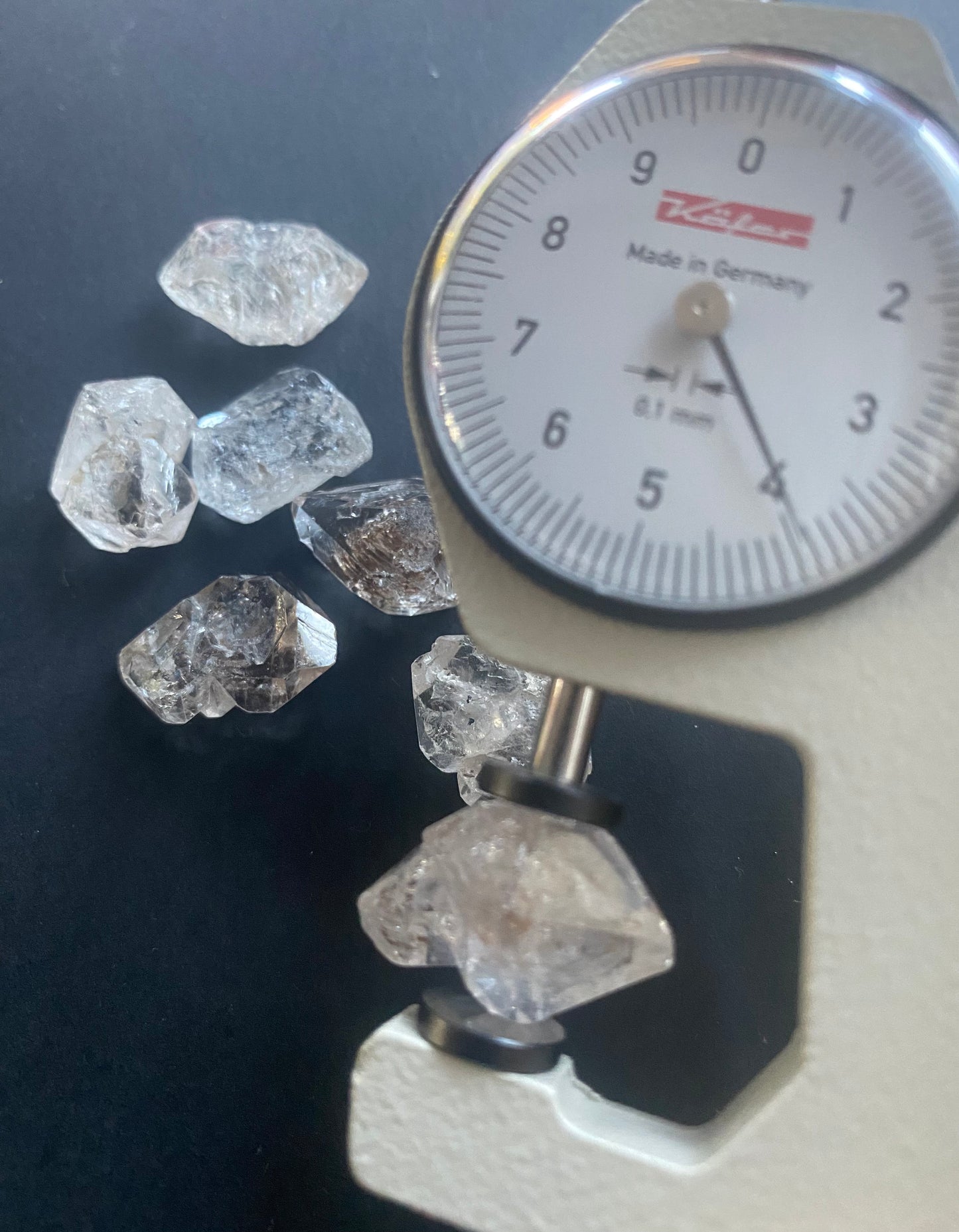 A dial gauge displaying a herkimer undrilled gemstone rough 14mm to 16mm in size.