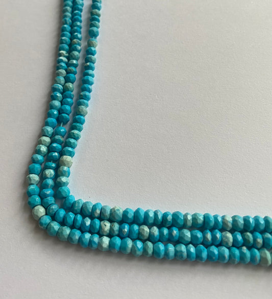 Howlite Turquoise beads in faceted rondelle shape, 4.5-5.0mm, threaded in a strand for a vibrant, elegant look.