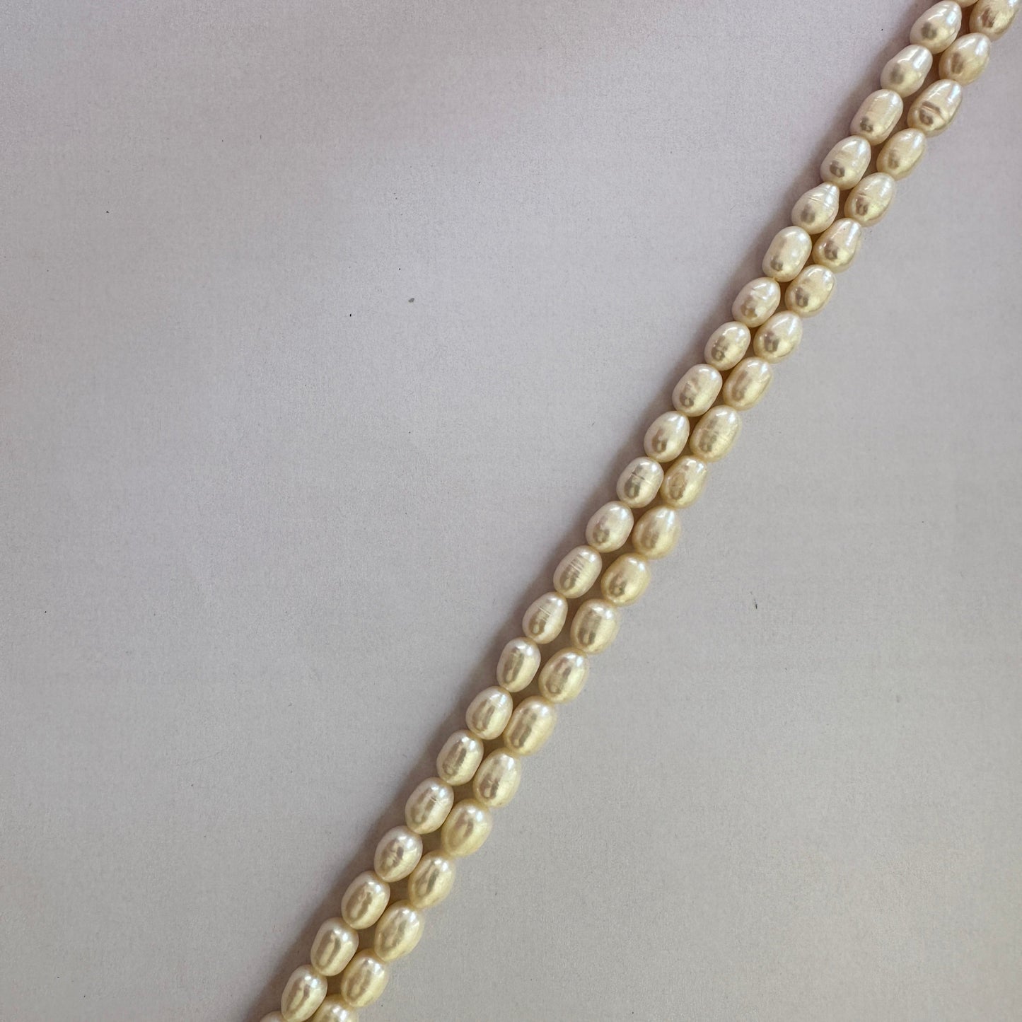 Freshwater Pearls in textured oval shape arranged on a 37cm strand with natural creamy glow.