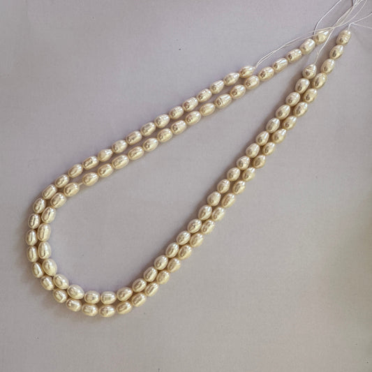 Close-up of Freshwater Pearl beads measuring 8.0 to 8.6mm long and 5.7 to 6.2mm wide.