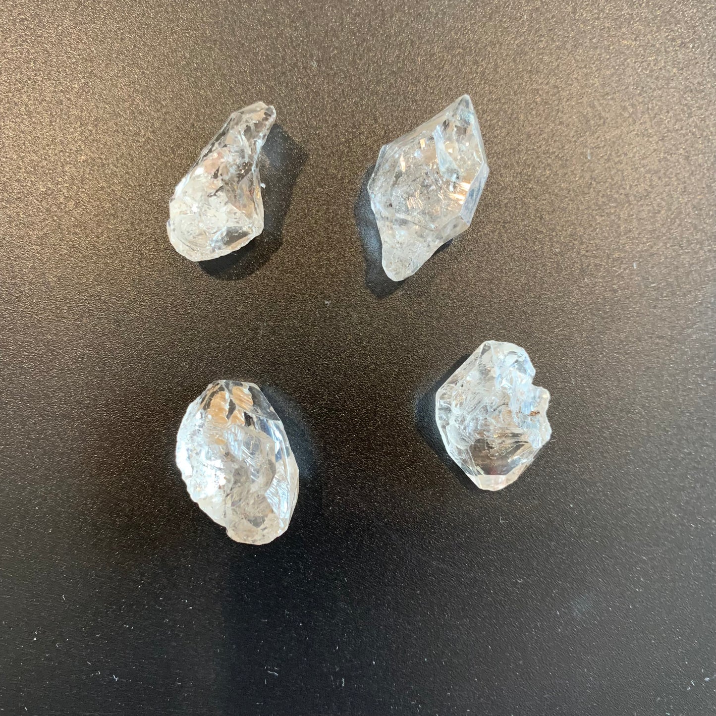 Herkimer Diamond rough undrilled crystals shimmer with remarkable transparency and organic inclusions.