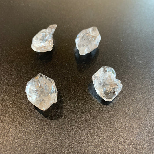 Close-up of Herkimer Diamond rough stones reveals their double-terminated structure and high-quality finish.