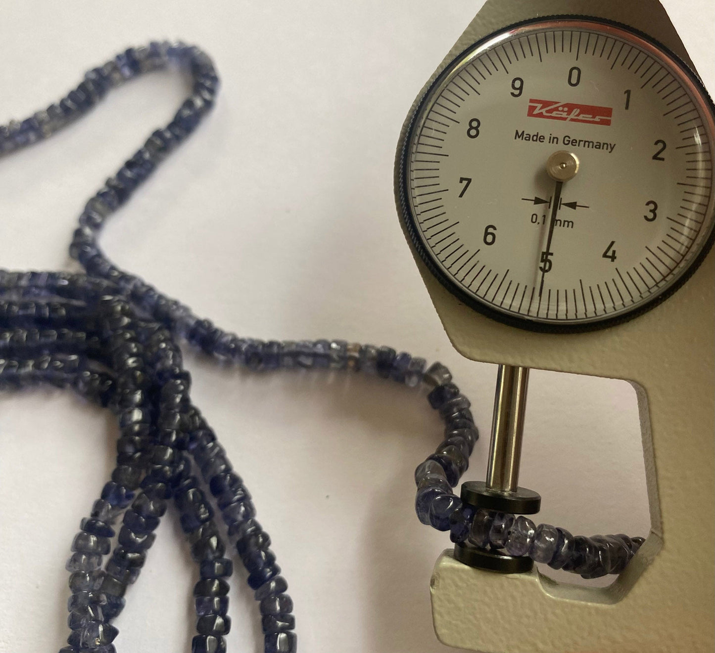 Beautifully polished iolite beads, smooth wheel cut, 5 to 5mm, offering brilliant colour and high-quality shine for professional jewellery creations