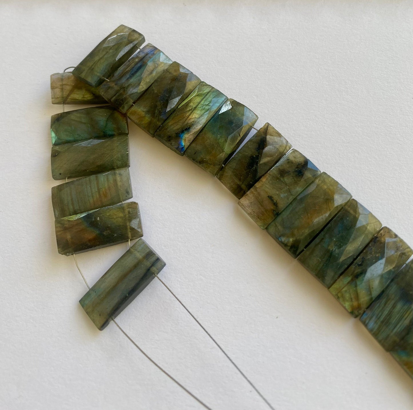 Close-up of 21mm x 9.5–10mm Labradorite rectangle beads showing their natural shimmer.