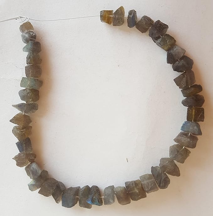 A strand of rough centre-drilled labradorite beads featuring yellow and brown hues, showcasing their unique natural beauty.
