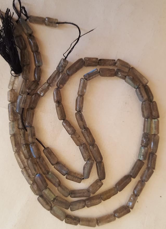 Chic strand crafted with smooth pipe-shaped black brown semi-precious Labradorite, perfect for any outfit.