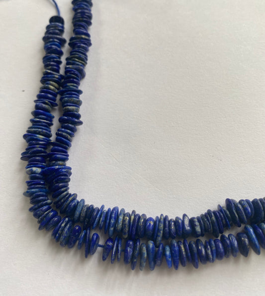Elegant gemstone strand adorned with Lapis Heishi smooth opal beads, highlighting the beauty of the gemstone.
