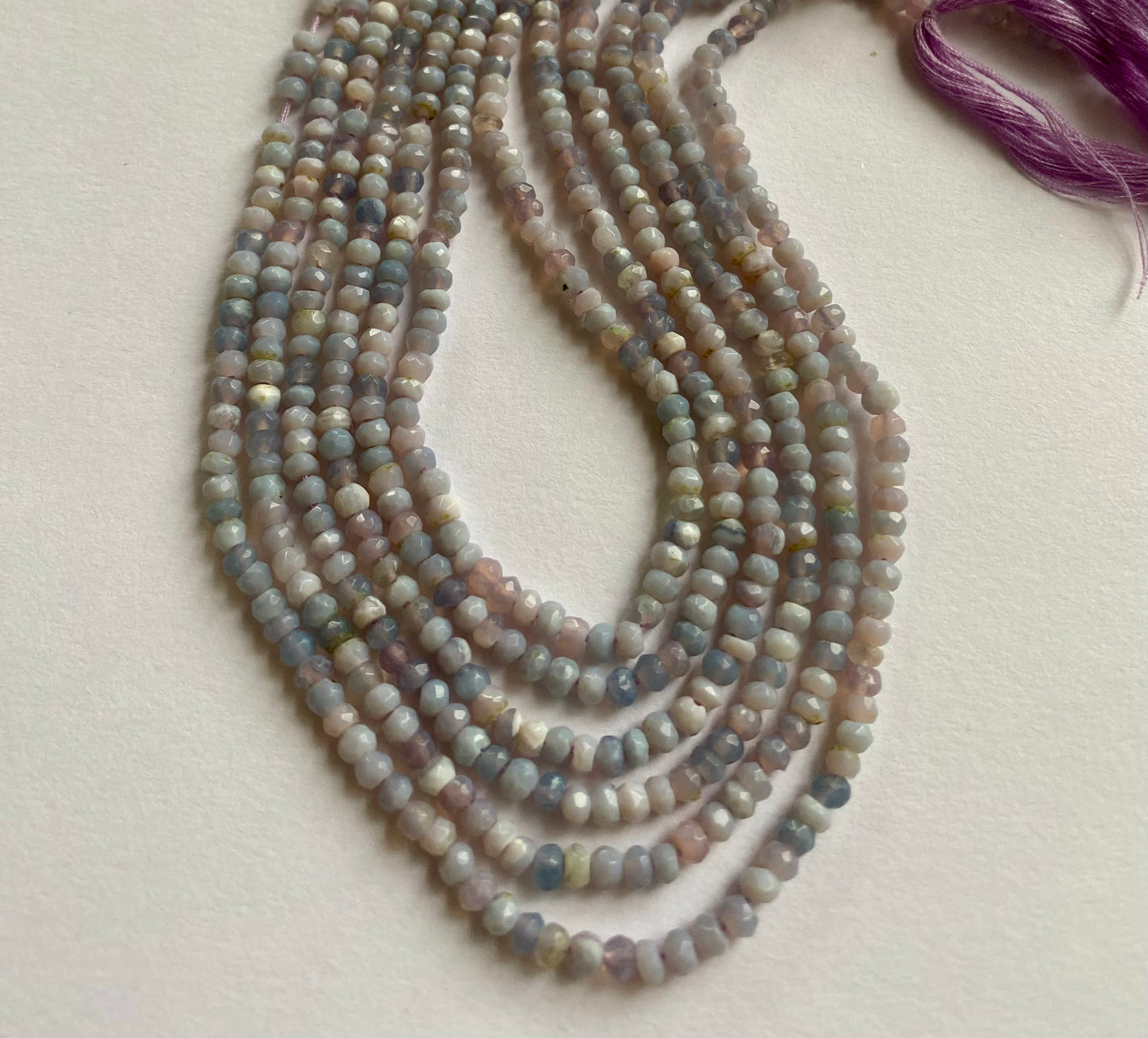 Strands of polished Lavender Opal beads, 3.0-3.2mm,displaying a bright and eye-catching natural colour.