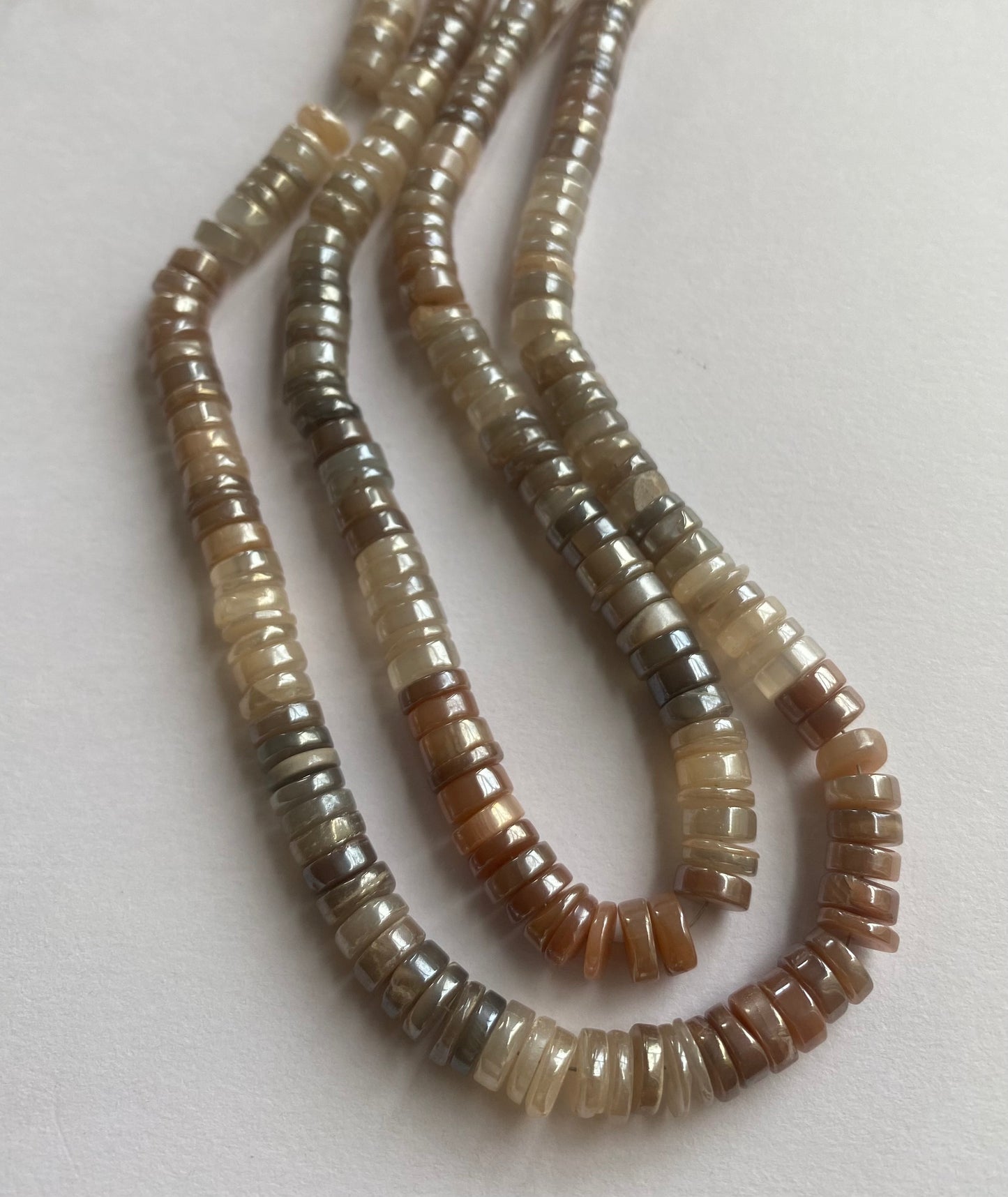 Strand featuring smooth wheel moonstone gemstones, 7mm in a stunning brown golden hue.