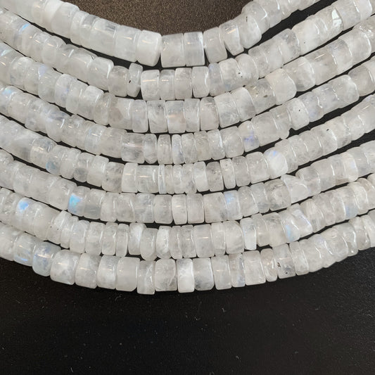 Moonstone bead strands arranged neatly, displaying their elegant round shape and subtle shimmer.