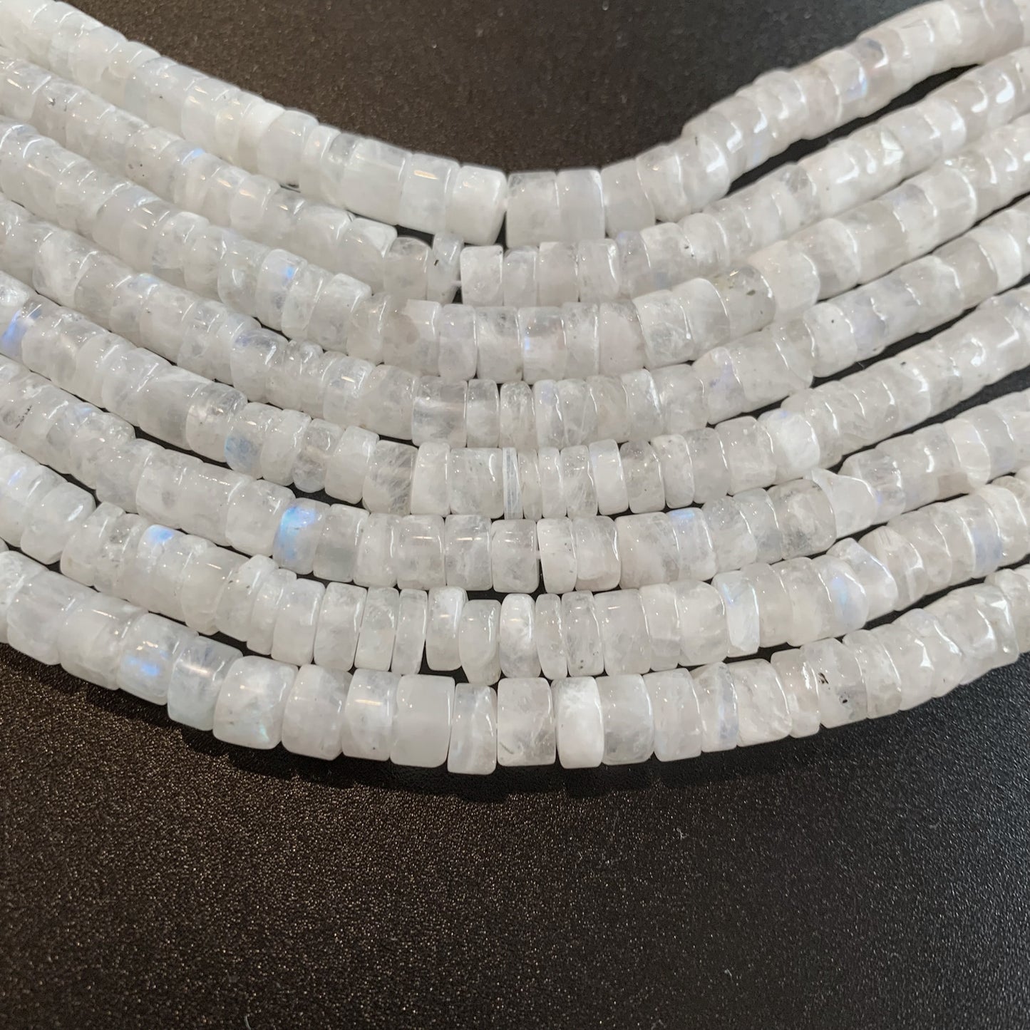 Gently polished Moonstone wheels radiate a pearly sheen, capturing light beautifully.