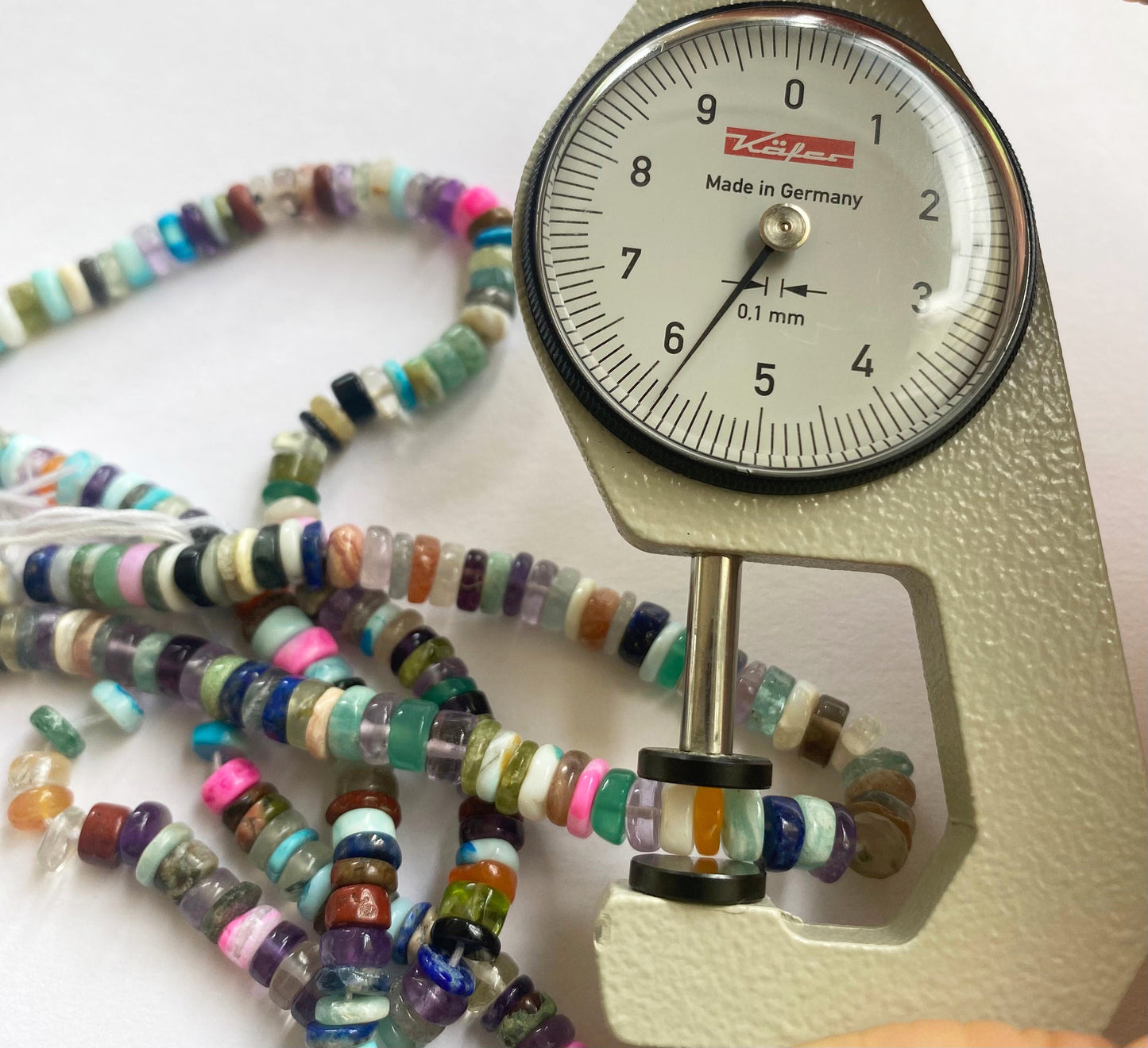 Multi Disco Smooth Wheel beads arranged in a cascading pattern, enhancing their visual appeal.