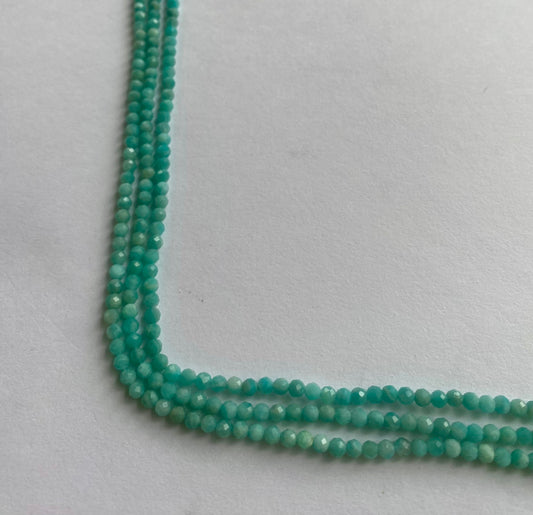 Elegant strands adorned with 3.4-3.5mm Amazonite faceted rondelle beads, showcasing a sleek design.