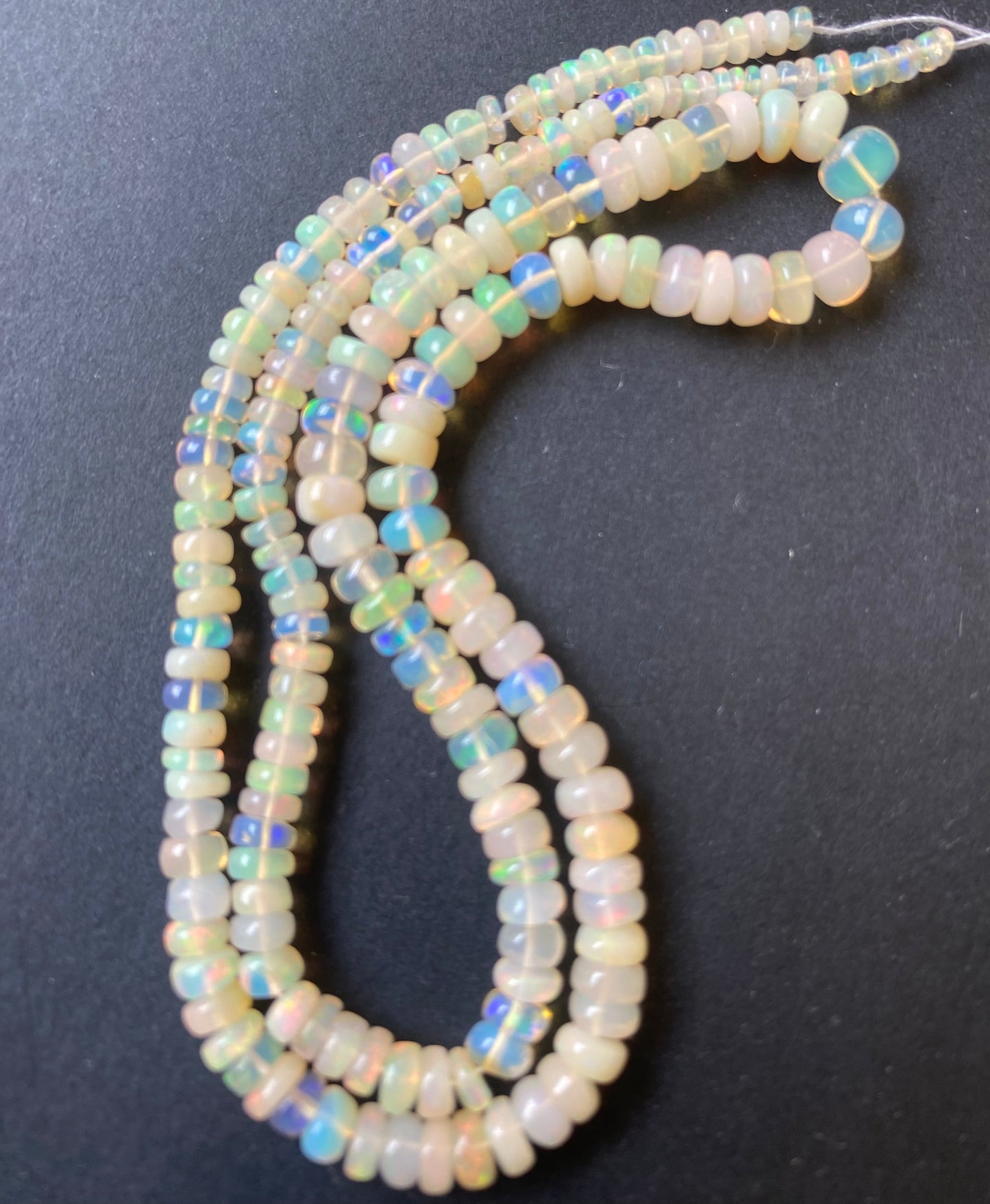 Stunning 2.7mm-5mm smooth rondelle opal gemstone beads, reflecting the unique charm of the gorgeous opals.
