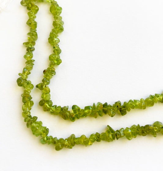 Natural Peridot gemstone chips 5 to 8mm featuring a smooth texture and radiant green tones ideal for elegant jewellery designs.