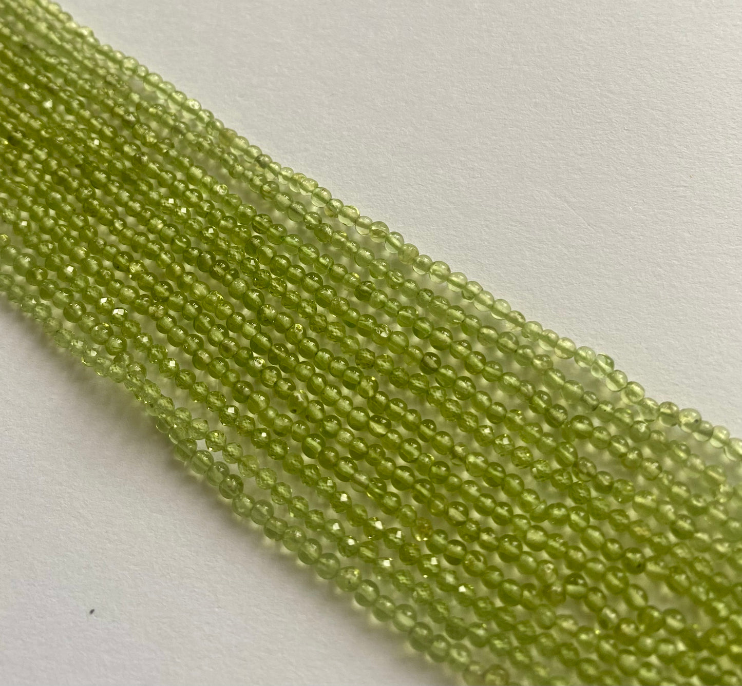 Elegant strand adorned with 2.5mm-to-2.8mm smooth rondelle peridot stones, showcasing a rich green colour.