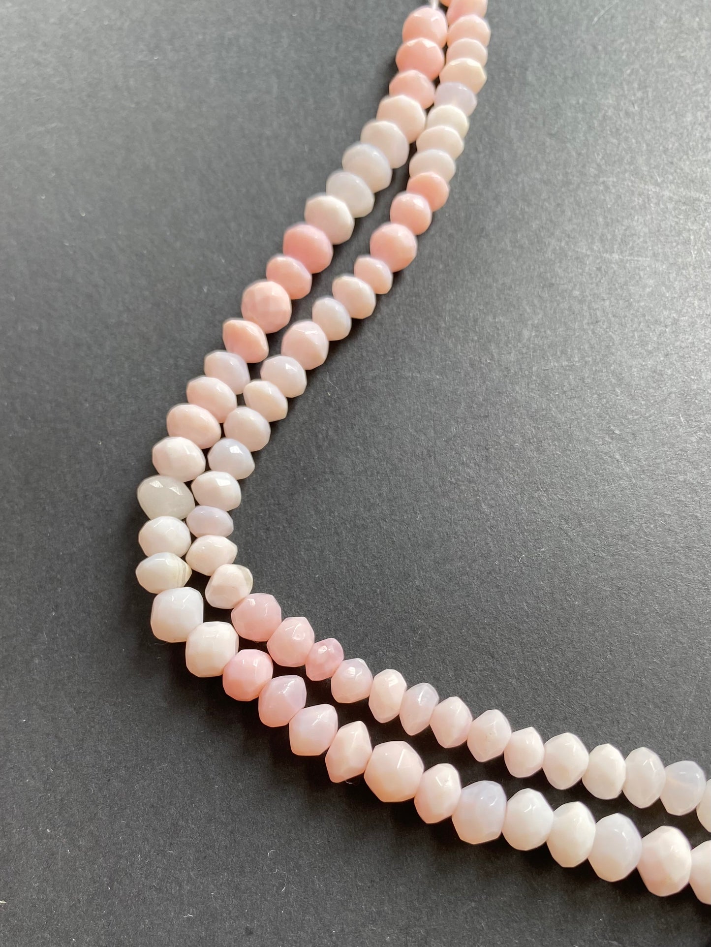 Stunning 6mm or 7mm smooth pink opal gemstone beads, reflecting the unique charm of opal gemstone.