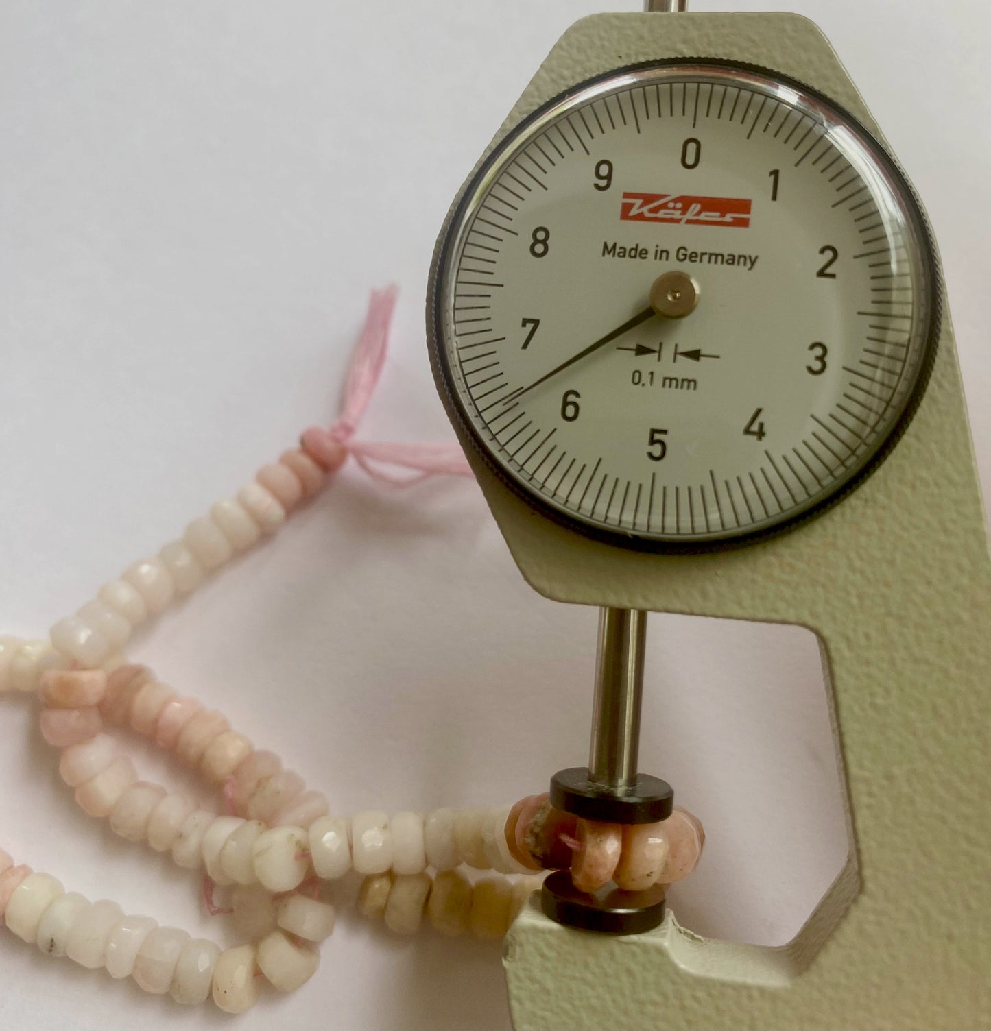 Elegant arrangement of Pink Shaded Opal beads, highlighting their natural color variations.
