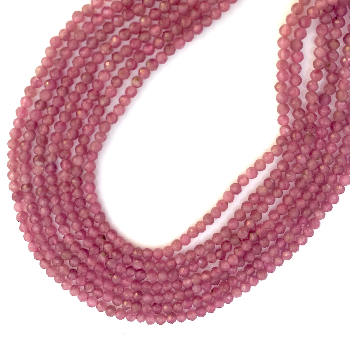 Elegant strand adorned with 3mm faceted rondelle pink tourmaline beads, showcasing a beautiful pink hue.