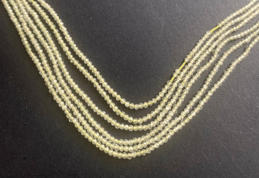 A cluster of faceted Prehnite beads, sized 1.9mm, showcasing their rich colour and texture.