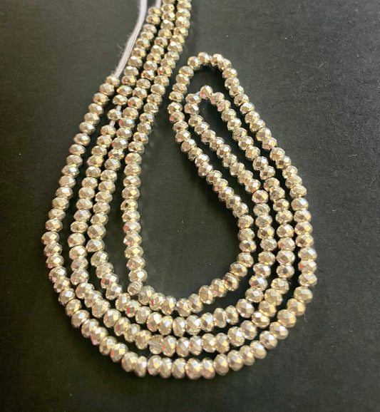 Elegant strand composed of small pyrite rondelle beads, each 3.1mm, with a 32cm length, perfect for any outfit and DIY jewellery making project.