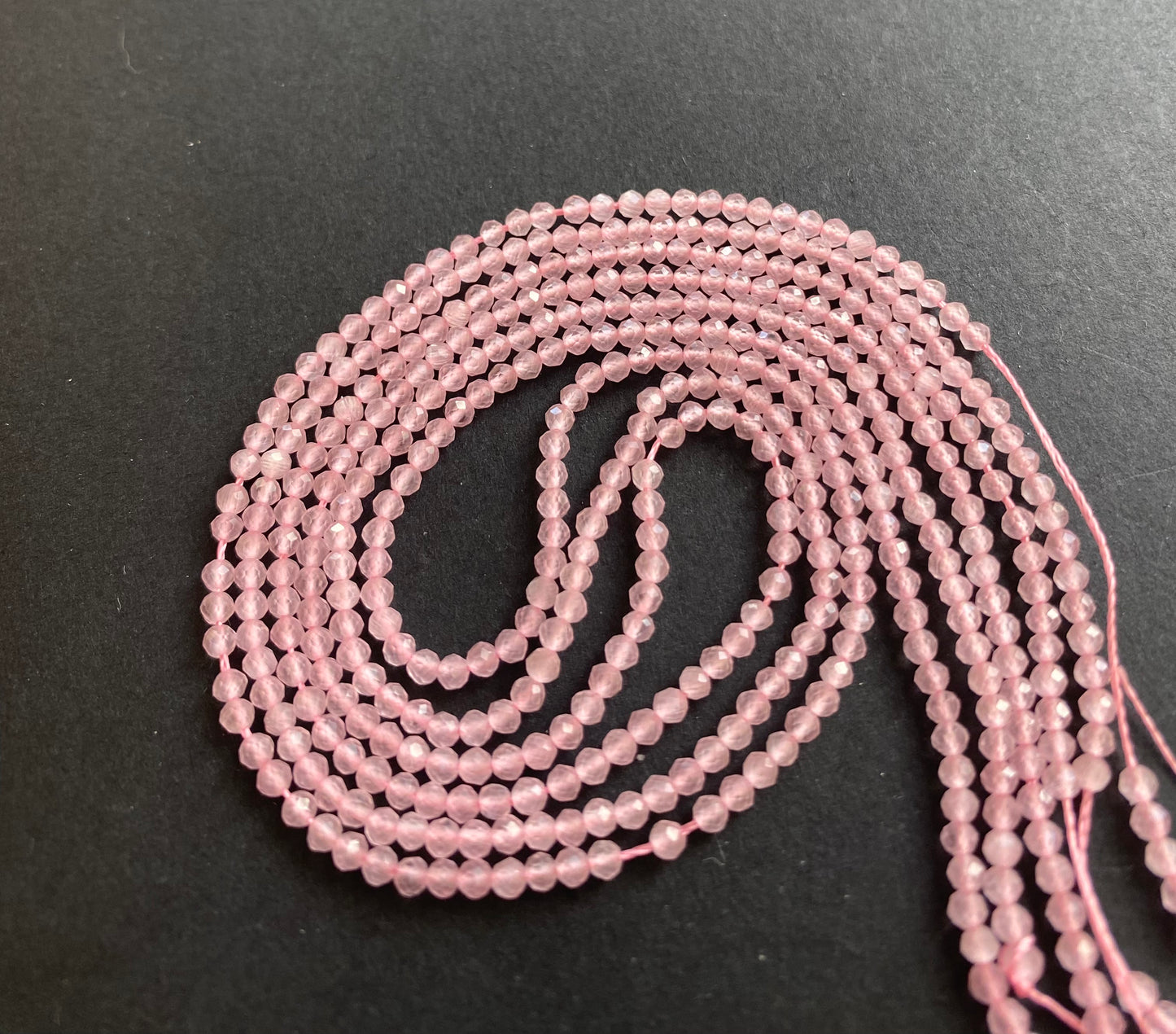Strand featuring faceted rondelle Rose Quartz gemstones, 2.5mm, in a stunning pink hue.