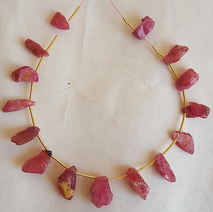 Elegant strand of rough natural ruby gemstone, beads sized 6mm to 7mm, highlighting their natural beauty and vibrant colour.